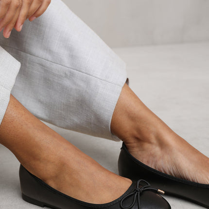 BEXLEY SLIP ON FLAT PUMPS IN BLACK FAUX LEATHER